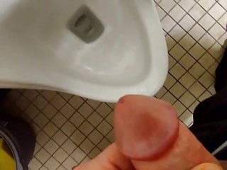Blasting a huge load over a urinal