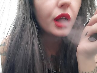 Sexy smoking fetish from Dominatrix Nika. Mistress smokes 2 thin cigarettes in a row, and you smell her smoke.