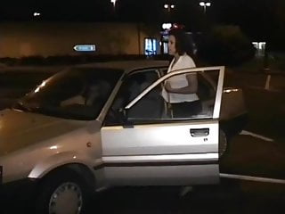 French girl pissing outdoors by a parked car