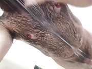 super hairy and bearded guy takes a shower