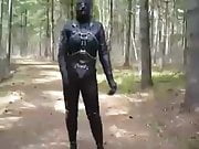 Full leather enclosure wank in public in the woods.