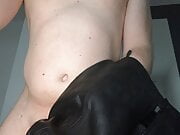 A horny leather skirt wank with a wet small cock 