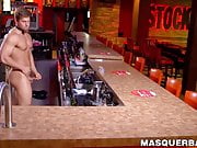 Buff stud strips nude to masturbate passionately behind bar