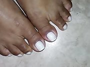  Closeup on Morenafeet's fingers with French nail polish