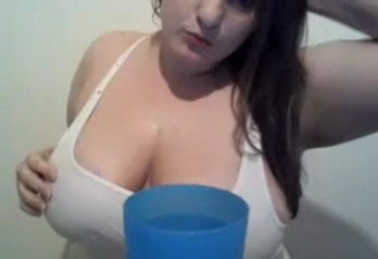 Big breast girl gets T shirt on and wet