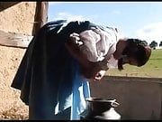 Milena milks herself at a farm