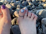Hot and sexy feet of Mistress Lara in the sunset on public beach