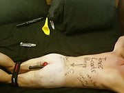 Humliliated faggot slave covered in degrading body writing
