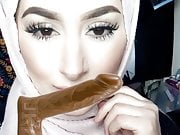 Hijabi rubs cock on face