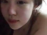 asian girl taking a video of herself