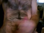 Hairy man jerking and blowing his milk