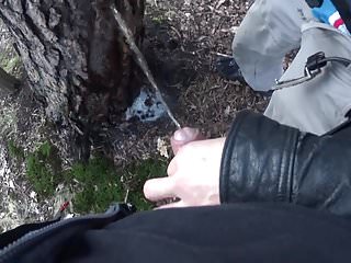 My boyfriend holding my pissing cock outdoor woods...
