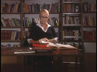 .Sexy blondie gives a huge cock a blowie on the big bed.