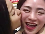 Chinese girl passionately kiss in restaurant 