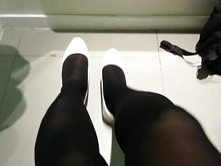 White patent pumps with black pantyhose...