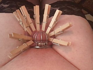 Sissy using wax and cloth pegs...