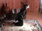 Latex Girl Muzzle Gagged with Armbinder and Catsuit