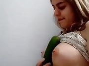 Iranian girl has fun with a cucumber 