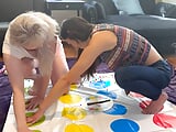 Two hot lesbians are playing a strip twister game