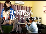 A giant secretary sits on an office desk. The manager guy is very surprised at her height.