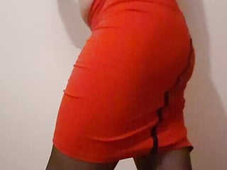 Crossdresser Lea showing off her ass in red tight skirt