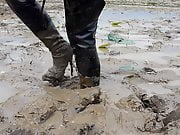 Two thai in thigh boots swim in mud!!!