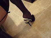 in black stockings and heels
