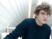 handsome boy with curly hair cums