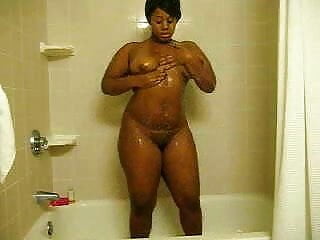 Curvy ebony teasing shower...